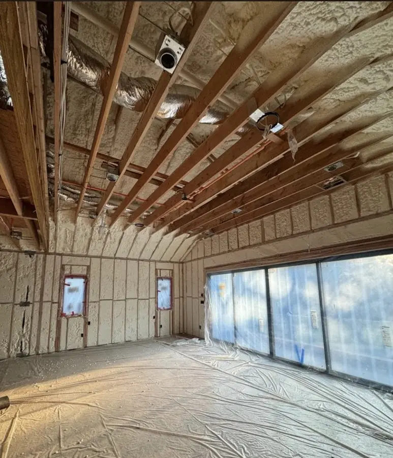 Interior walls and ceiling insulated with spray foam during new construction in West Springfield